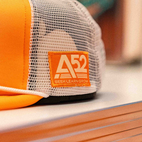 The Flying Saucer Diner Trucker Hat in Sunset Orange