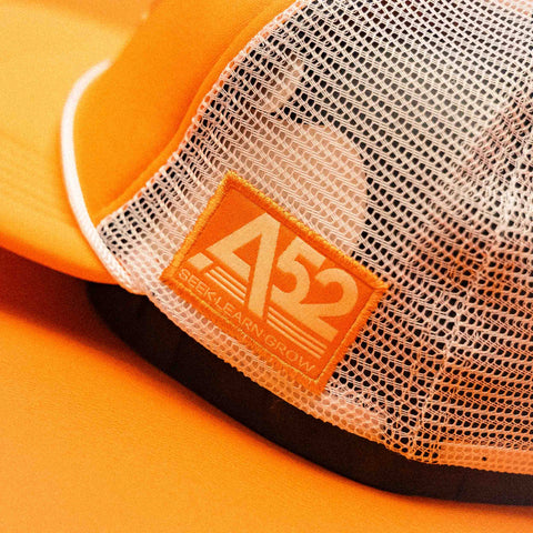 The Flying Saucer Diner Trucker Hat in Sunset Orange