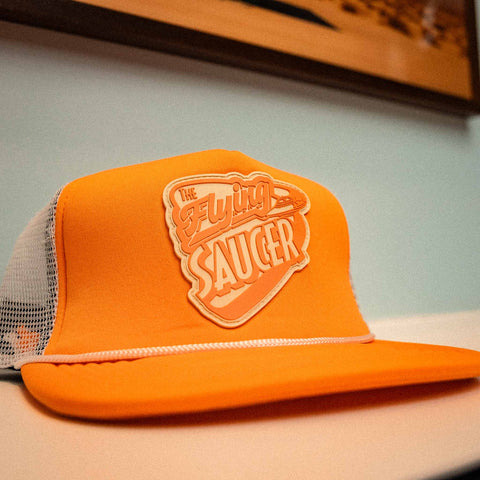 The Flying Saucer Diner Trucker Hat in Sunset Orange